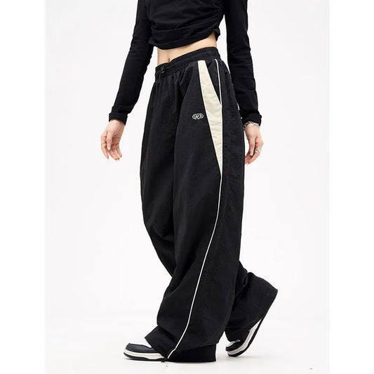Calça retrô listra lateral, perna larga, cintura alta
